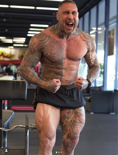 Diego Waller posing on the gym floor after training